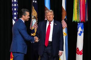 U.S. President Donald Trump, right, greets U.S. Secretary of War Pete Hegseth as he arrives to speak to senior military leaders at Marine Corps Base Quantico on Sept. 30, 2025, in Quantico, Virginia. In an unprecedented gathering, almost 800 generals, admirals and their senior enlisted leaders have been ordered into one location from around the world on short notice. (Andrew Harnik/Getty Images/TNS)