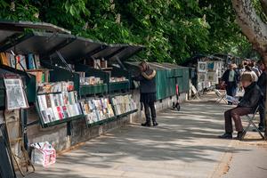 In Paris, “bouquinistes” sell used books and memorabilia from green metal stalls that line the Left Bank of the Seine River. (Cameron Hewitt, Rick Steves’ Europe)