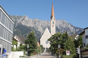 In Liechtenstein’s towns, it’s common to see quaint churches bumping up against modern business buildings. (Rick Steves, Rick Steves’ Europe)