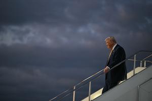 U.S. President Donald Trump alights from Air Force One upon arrival at Haneda Airport in Tokyo on Oct. 27, 2025. (Andrew Caballero-Reynolds/AFP via Getty Images/TCA)