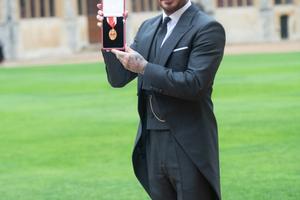 Bang Showbiz / Sir David Beckham paid tribute to his wife Victoria Beckham with his knighthood ceremony outfit.