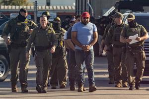 U.S. Border Patrol chief Greg Bovino leads detainees into the Immigration and Customs Enforcement holding facility in Broadview, Illinois, on Sept. 27, 2025. (Dominic Di Palermo/Chicago Tribune/TNS)