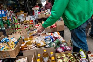 People shop for food in a Brooklyn neighborhood that has a large immigrant and elderly population on Oct. 16, 2023, in New York City. Following the end of a pandemic food assistance benefit, over 1.7 million New York City residents currently rely on the Supplemental Nutrition Assistance Program (SNAP), also known as food stamps. With the number of those in need of food assistance growing, the Salvation Army has reported that they’ve served 53% more meals to New Yorkers in the first nine months of 2023. (Spencer Platt/Getty Images/TNS)