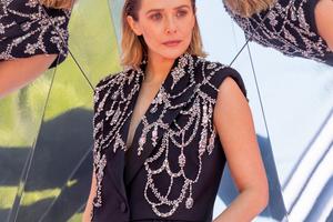 Bang Showbiz / Elizabeth Olsen would love to live in England one day.