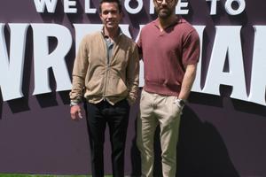 Bang Showbiz / Ryan Reynolds and Rob McElhenney have sold part of Wrexham to a US group