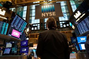 Traders work on the floor of the New York Stock Exchange at the opening bell Jan. 25, 2022. (Timothy A. Clary/AFP/Getty Images/TNS)