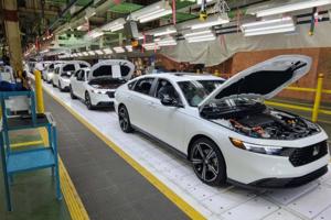 Henry Payne/The Detroit News/TNS