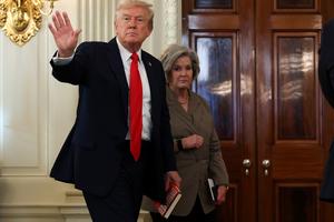 U.S. President Donald Trump, left, departs with White House Chief of Staff Susie Wiles following a roundtable discussion in the State Dining Room of the White House on Oct. 8, 2025, in Washington, D.C. (Anna Moneymaker/Getty Images/TNS)