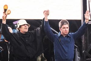 Bang Showbiz / Oasis stars Liam Gallagher and Noel Gallagher on stage at Murrayfield Stadium in Edinburgh