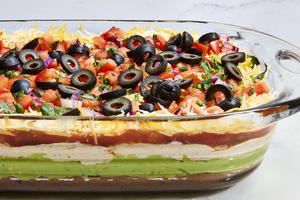 This party staple is everything you love about a taco, from the refried beans and guac to sour cream and pico de gallo, served dip-style. (Ryan Liebe/TCA)