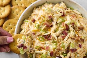A creamy, cheesy dip loaded with bacon, toasted almonds, and a hint of spice, perfect for parties or snacking. (Alex Lepe /TCA)
