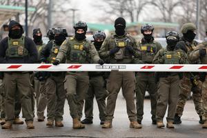 U.S. Border Patrol agents stand guard at the Bishop Henry Whipple Federal Building in Minneapolis, Minn., on Jan. 8, 2026.   Charly Triballeau/AFP via Getty Images