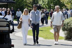 Julia Hartz, CEO of Eventbrite, Kevin Warsh, and Kevin Hartz, former CEO of Xoom, leave after the morning-session at the Allen & Company Sun Valley Conference on July 10, 2024 in Sun Valley, Idaho. (Kevork Djansezian/Getty Images/TNS)