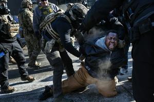 ICE officers and federal agents clash with protesters in south Minneapolis after Alex Pretti was fatally shot by federal agents on Jan. 24, 2026.  Richard Tsong-Taatarii/The Minnesota Star Tribune