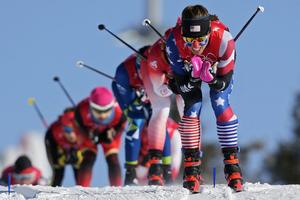 U.S. skier Rosie Brennan leads a group during the women's team sprint classic cross-country skiing competition at the 2022 Winter Olympics.  AP Photo/Aaron Favila