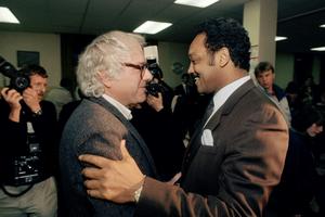Bernie Sanders, then the mayor of Burlington, greets Jesse Jackson backstage at a 1988 Vermont rally where he endorsed Jackson's presidential bid. AP Photo/Toby Talbot