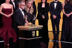 Bang Showbiz / One Battle After Another's team accepting the Best Film gong at the 2026 EE BAFTA Film Awards