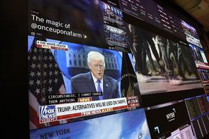 NEW YORK, NEW YORK - FEBRUARY 20: A press conference by U.S. President Donald Trump on tariffs is displayed on a television as traders work on the floor of the New York Stock Exchange during afternoon trading on February 20, 2026 in New York City. Stocks opened up mixed with the Dow Jones nearly 200 points at opening amid a weak gross domestic product for the fourth quarter. The Supreme Court ruled 6-3 on a decision against President Donald Trump’s tariffs. (Photo by Michael M. Santiago/Getty Images)