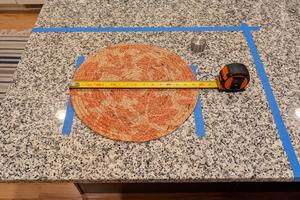 This placemat, painter's tape, a tape measure, and your island or countertop allow you to know if the vessel sink and faucet will work together. (Tim Carter/Tribune Content Agency/TNS)