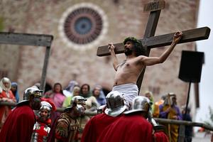 Actors and spectators take part in a re-enactment of the crucifixion of Jesus Christ on Good Friday in Bensheim, western Germany on April 18, 2025. Christian believers around the world mark the Holy Week of Easter remembering the crucifixion and resurrection of Jesus Christ. (Photo by Kirill KUDRYAVTSEV / AFP) (Photo by KIRILL KUDRYAVTSEV/AFP via Getty Images)