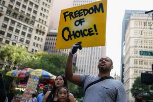 Protestors opposed to Covid-19 vaccine mandates and vaccine passports by the government rally at City Hall in New York City on August 25, 2021. (Photo by Angela Weiss / AFP) (Photo by ANGELA WEISS/AFP via Getty Images)