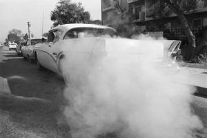 Before catalytic converters, starting a gas-powered vehicle could choke the surrounding area with smog. Bettmann via Getty Images