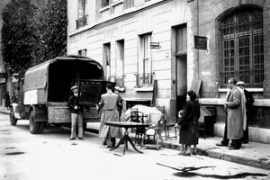 Furniture confiscated from Jewish homes is delivered to other people in Boulogne-Billancourt, Paris in April 1942, after an Allied bombing. Art Media/Print Collector/Getty Images