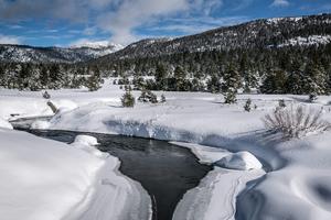 In a good year, the West's mountain snowpack feeds streams and rivers well into summer. George Rose/Contributor/Getty Images News