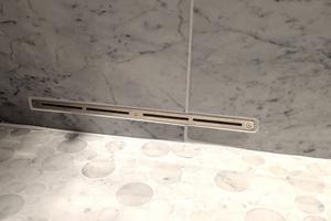 This narrow slot is connected to a high-speed fan that blows air into a shower. The air removes the water, stopping the growth of mold and mildew. (Tim Carter/Tribune Content Agency)