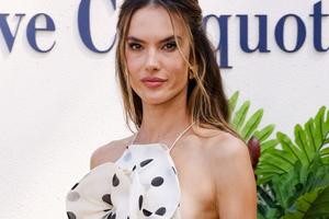 Bang Showbiz / Alessandra Ambrosio has sparked engagement speculation after appearing with a gold band on her wedding finger in new images shared from Bali -- with her relationship with Buck Palmer drawing renewed attention