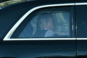 U.S. President Donald Trump rides in his motorcade as he departs the White House for the Supreme Court in Washington, D.C., on April 1, 2026. Trump attended in person as the Supreme Court heard a landmark case weighing the constitutionality of his contentious bid to end birthright citizenship, an extraordinary and possibly unprecedented move for the nation's highest office. (Brendan Smialowski/AFP/Getty Images/TNS)