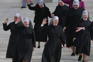 WASHINGTON, DC - MARCH 23:  Mother Loraine Marie Maguire, (C), of the Little Sisters of the Poor, walks down the steps of the US Supreme Court after arguments, March 23, 2016 in Washington, DC. The high court heard arguments in Little Sisters v. Burwell, which will examine whether the governments new health care regulation will require the Little Sisters to change their healthcare plan, to other services that violate Catholic teaching.  (Photo by Mark Wilson/Getty Images)