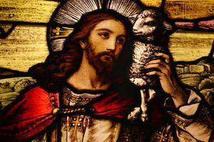 Jesus with Lamb. Stained glass depicting Jesus holding a lamb. Dreamstime/TCA