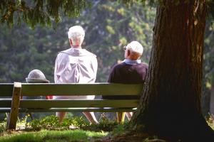 Senior couple taking a rest on a hiking trip. Dreamstime/TCA