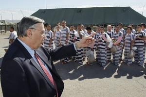 Maricopa County Sheriff Joe Arpaio orders undocumented immigrants handcuffed together and moved into a separate area of Tent City in Phoenix on Feb. 4, 2009. AP Photo/Ross D. Franklin, File