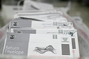 Mail-in ballots in their envelopes await processing at the Los Angeles County Registrar-Recorder's mail-in ballot processing center in Pomona, Calif., on Oct. 28, 2020. Robyn Beck / AFP via Getty Images