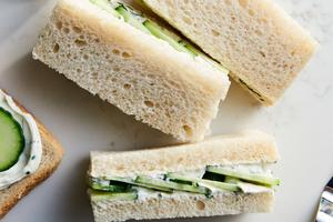 Tea sandwiches made with thinly sliced cucumber, fresh herbs, and seasoned cream cheese are perfect for any gathering. (Joe Lingeman/TCA)