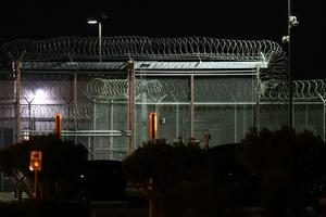 Barbed wire surrounds the GEO Group ICE detention facility in Adelanto, Calif. on July 10, 2025.  Patrick T. Fallon/AFP via Getty Images