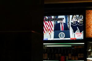 A TV displays U.S. President Donald Trump's prime-time address on the war in Iran inside a Cheesecake Factory on April 1, 2026, in Washington, D.C.  Anna Moneymaker/Getty Images