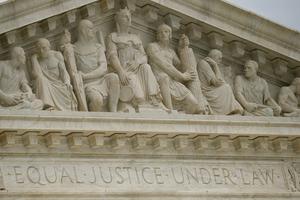 Carving's on the front of the U.S. Supreme Court building reads 