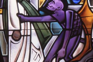 Stained Glass depiction of Devil tempting Jesus in the desert. Dreamstime/TCA