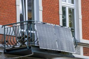 Small-scale solar panels mounted on balconies can help more households use renewable energy. Jens Büttner/picture alliance via Getty Images