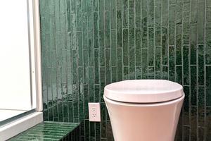 This sleek wall-hung toilet is in a basement bathroom, not a fancy hotel. (Tim Carter/Tribune Content Agency/TNS)