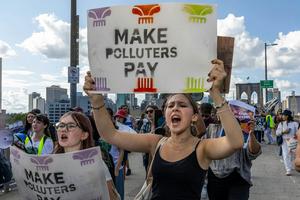 Across the U.S., people are calling for companies to pay for the damage they have done to the environment. Alex Kent/AFP via Getty Images