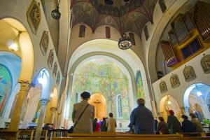 Praying in church. Dreamstime/TCA
