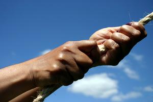 Woman pulling rope, strength. Dreamstime/TCA