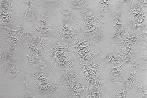 The textured topcoat creates a decorative finish with swirls and stippling effects that call attention to the ceiling. (Dreamstime/TCA)