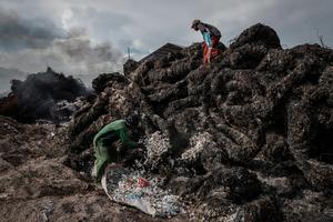 Workers prepare to burn imported plastic waste at a dump in East Java, Indonesia, in 2018. Ulet Ifansasti/Getty Images