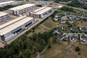 An Amazon data center sits next to a neighborhood in northern Virginia. Nathan Howard/Getty Images