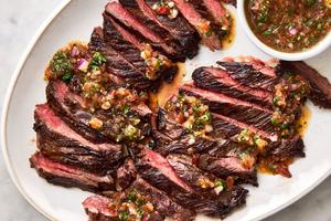 Skirt steak grills up quickly and is topped with juicy summer tomato salsa. (Rachel Vanni/TCA)